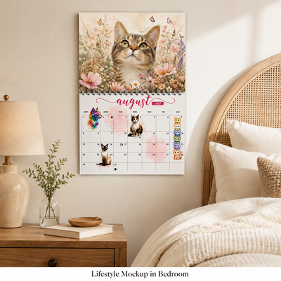 Watercolor Cats 2027 Wall Calendar displayed in bedroom lifestyle setting